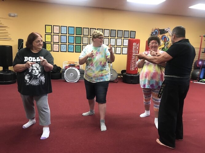 Individuals from Lorain County that Ability Works serves participate in a karate class.