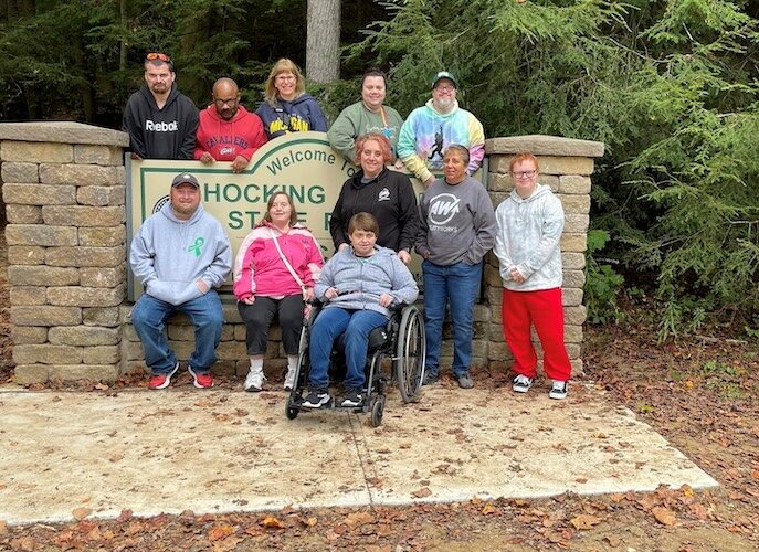 In 2023, Ability Works took its first community respite outing to Hocking Hills. Its CEO, Doreen Ehlert – top row, third from the left – went on the trip with staff and eight clients.