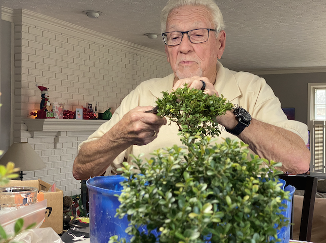 Paul Decker demonstrates proper trimming technique during his visit to the Werling house in December 2021.