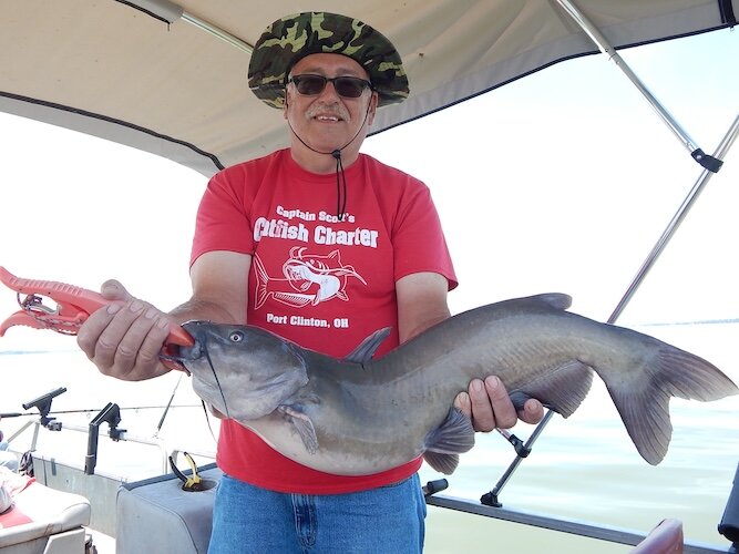 Captain Scott Heston, of Captain Scott’s Catfish Charters with the namesake species that keeps his clients returning to Sandusky Bay.