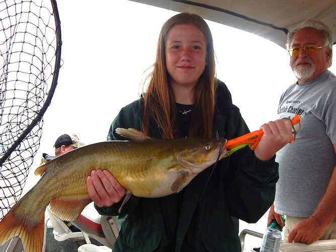 Madi Shields of West Mansfield with her biggest fish of the day, weighing 9.8 pounds.