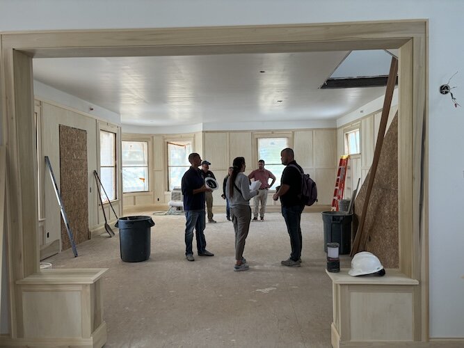 Ohio Department of Natural Resources employees check out the progress on restoring the Lonz mansion on Aug. 23.