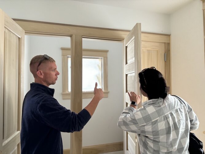 Ted Welsh, Capital Improvement Administrator for ODNR, Division of Parks and Watercraft, shows Karina Cheung, ODNR Media Communications and Outreach Specialist, the pantry in the kitchen. The pantry includes a window.