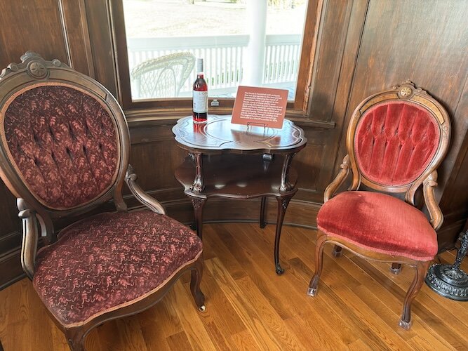 Mark Webster donated period artifacts, including the red velvet chairs in the living room sitting area.