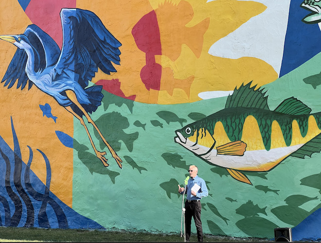 Shores & Islands Ohio President Larry Fletcher speaks during the mural dedication ceremony.