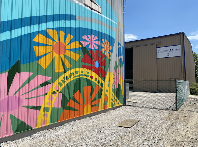 The mural faces First Street on one of the Venetian Marina buildings.