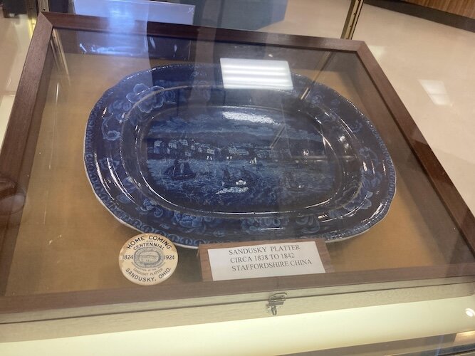 This rare platter features Sandusky. It was made between 1838 and 1842 and is Staffordshire China. 