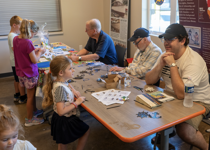 Young visitors learn more about nature on the opening day of the nature center.