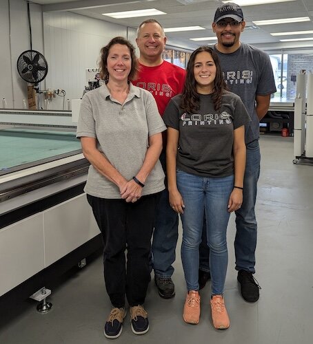 Four members of the Loris Printing team are Debby and Craig Hofer and Jenna and Zeke Ford.