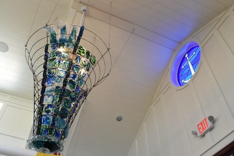 A three hundred pound handblown glass chandelier in the entryway of the Beach Glass Lounge in Lakeside Marblehead, created by owner and artist Cary Ferguson, is sure to catch the eye of visitors.