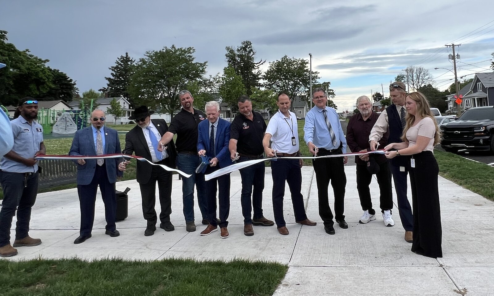 Sandusky officials gather for the ribbon cutting ceremony of the Warren Street reconstruction project.